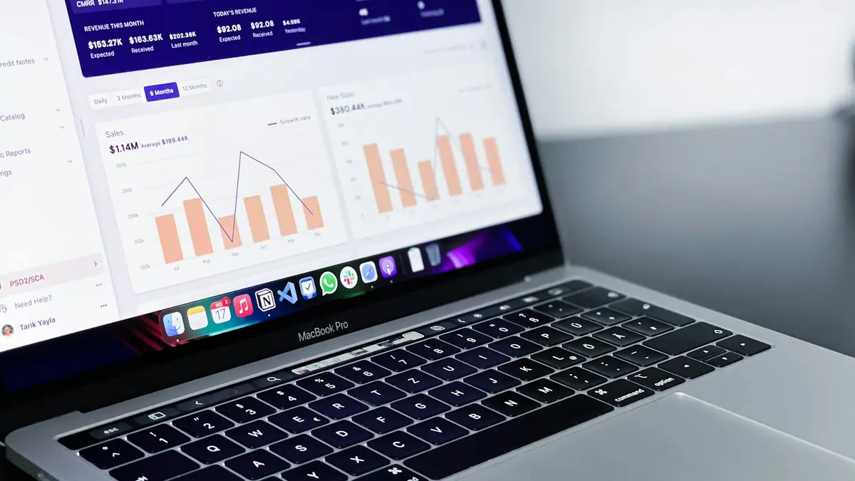 Laptop showing an analytics dashboard with charts